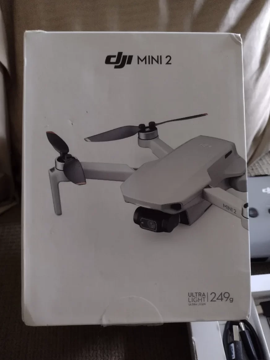 Selling my DJI Mini 2 Drone a white box with an image of the drone is visible.