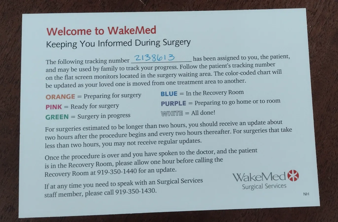 WakeMed surgery tracking card with assigned patient tracking number 2138613 and color-coded surgery status key