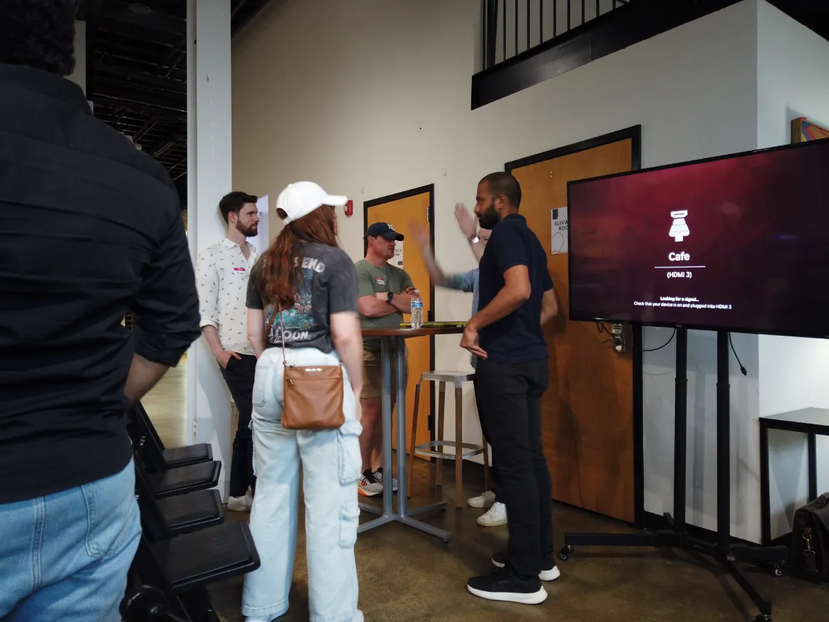a group of event attendees conversing and socializing