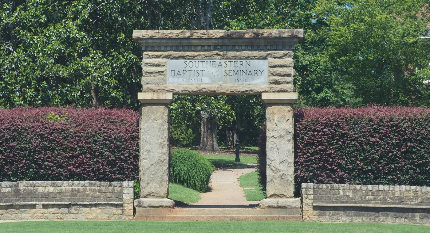 Stone archway inscribed with Southeastern Baptist Seminary, Founded 1950, 2 Tim 3:17